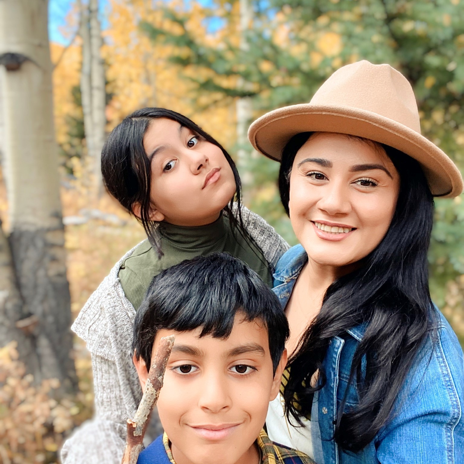 Iliana in the forest with her two children